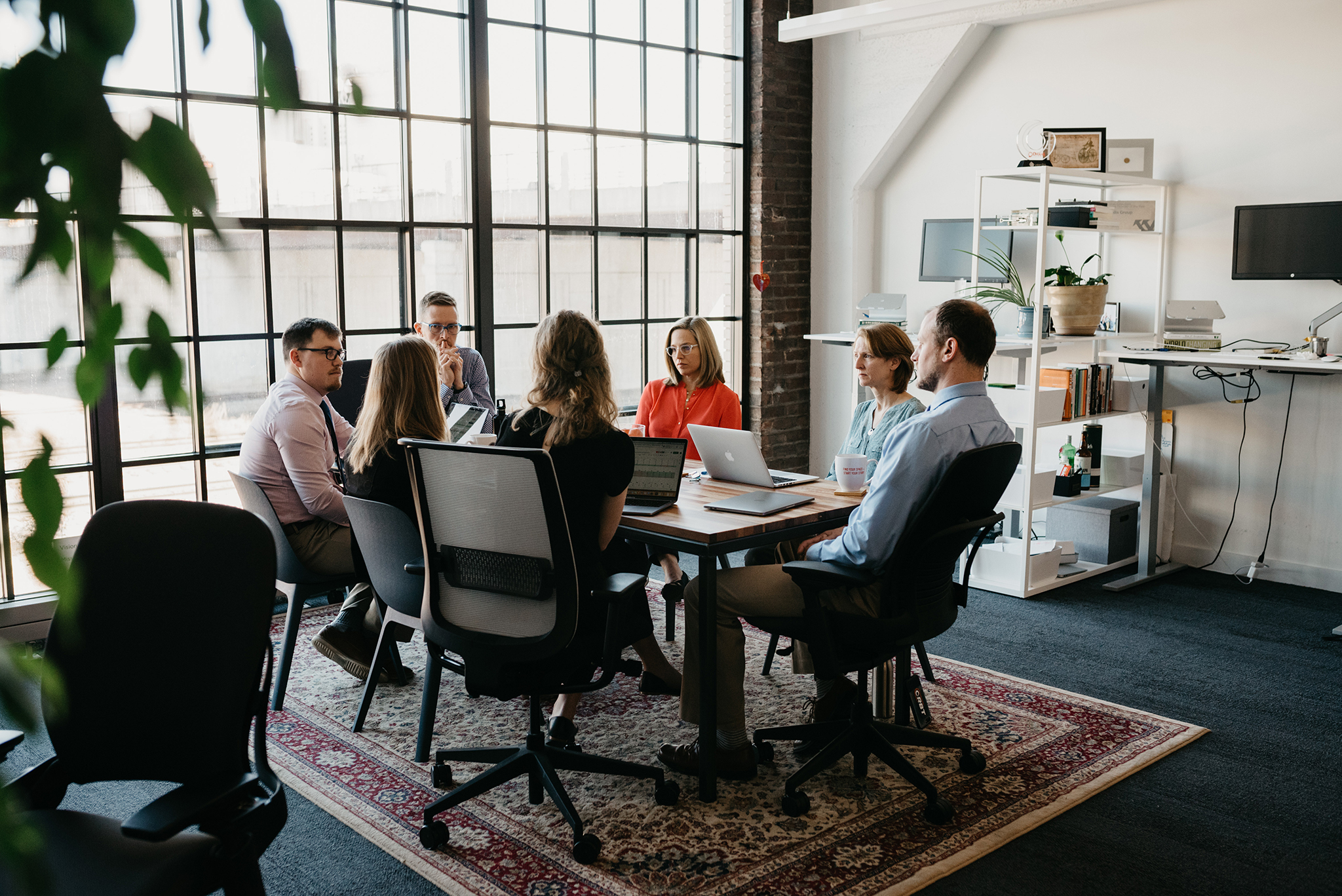 Team Verdis around a table having a meeting